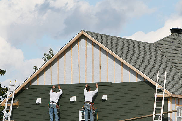 Professional Siding Replacement technician working in Lake City, PA